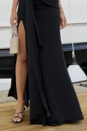 Anora – black maxi dress with train and halter neckline