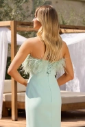 Fausta - corset dress with feathers