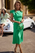 Noelia - Green midi dress with asymmetrical cut, decorative sleeves and sash