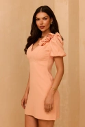 Flare - Peach shade mini dress with V neckline, buff sleeves and detachable brooch