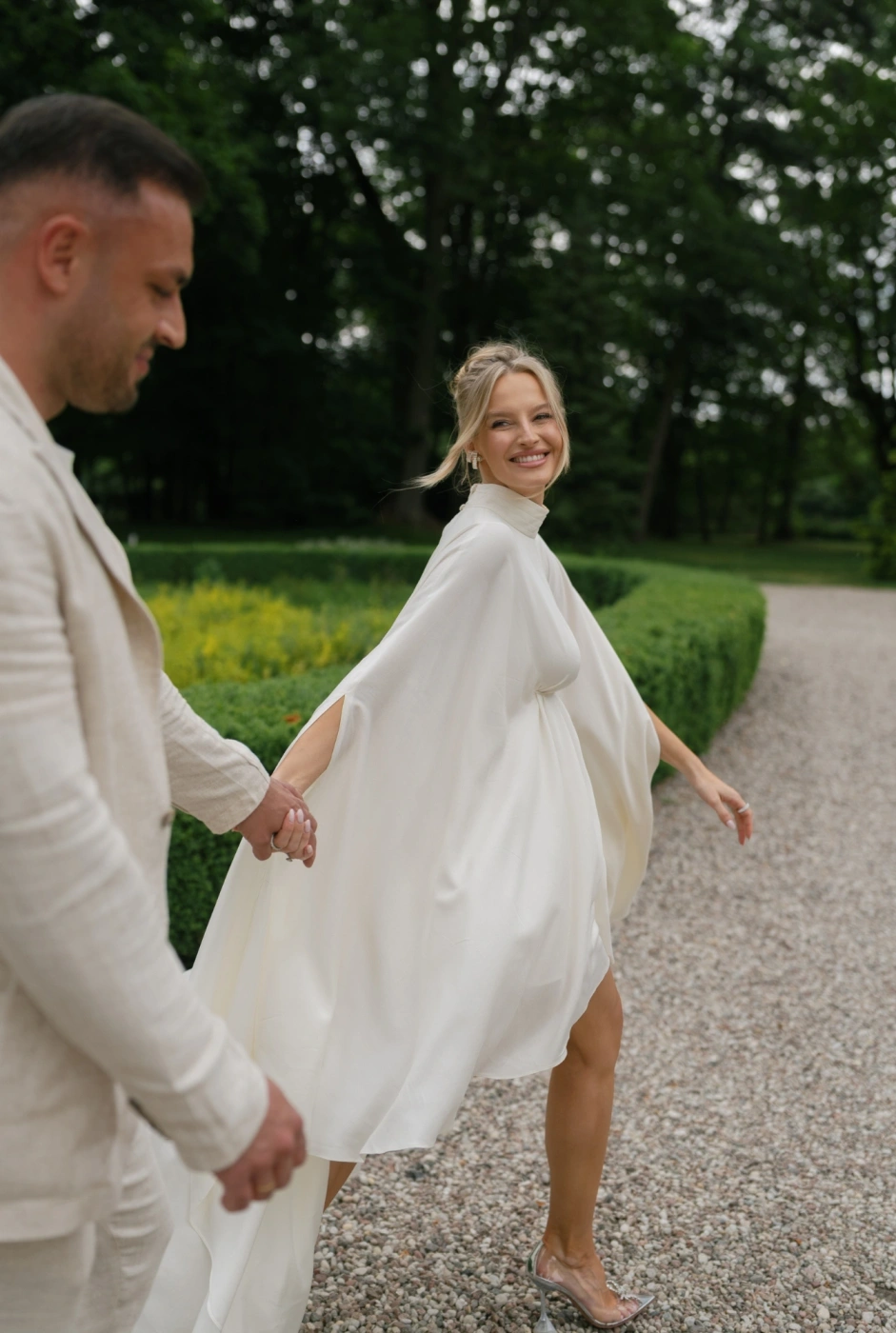 Larumi – ecru maternity dress with a cape silhouette