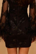 Unella – black mini dress with feathers