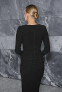 Uriona – black maxi dress with shoulder pads