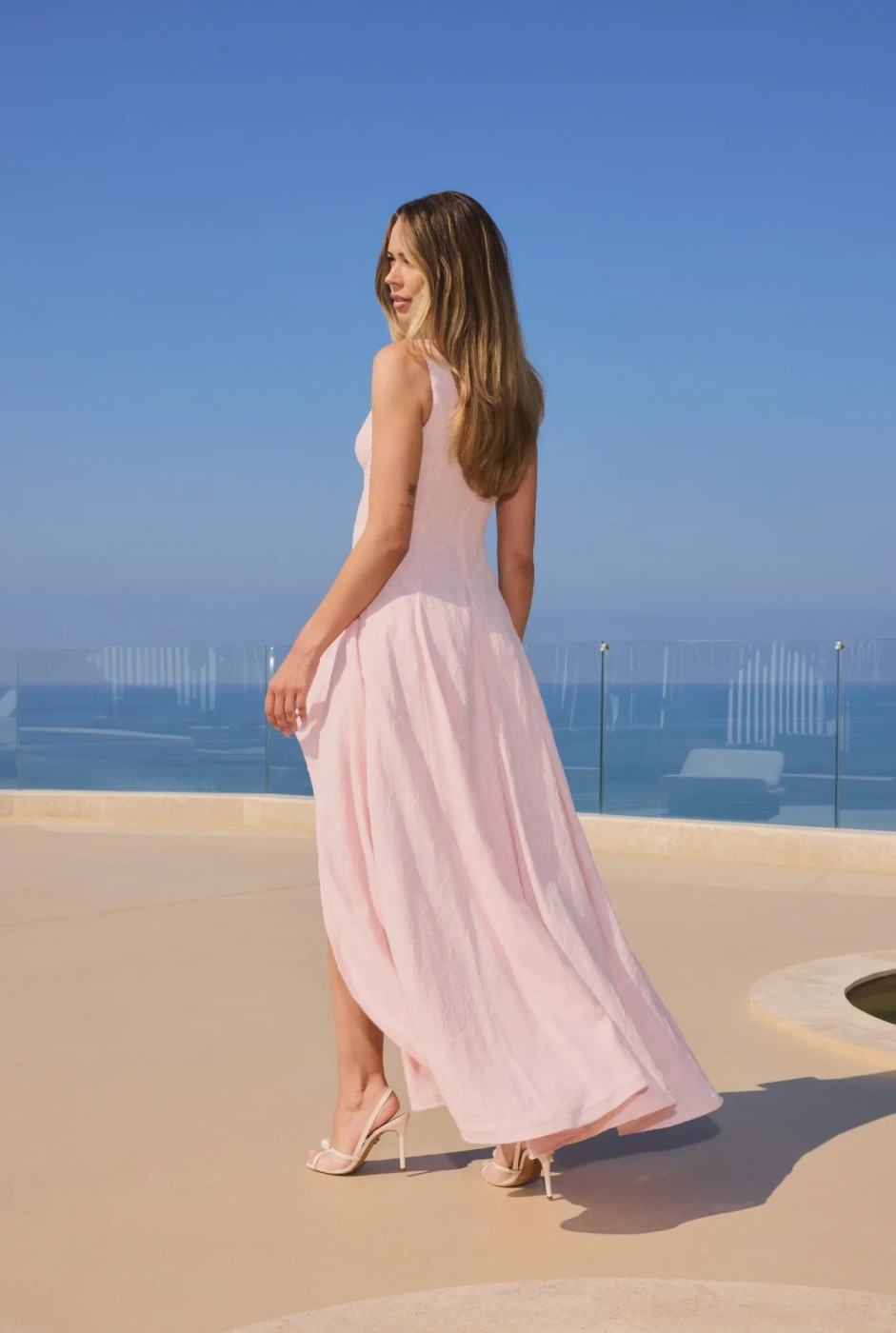 Elmina – light pink midi dress with an asymmetrical hem