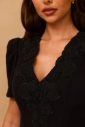 Caspera - black mini dress with floral appliqué