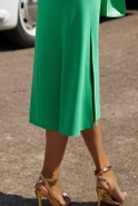 Noelia - Green midi dress with asymmetrical cut, decorative sleeves and sash
