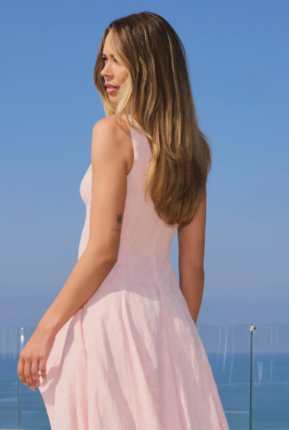 Elmina – light pink midi dress with an asymmetrical hem