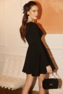 Malati - Blinkendes Minikleid mit tiefem Ausschnitt und Mesh