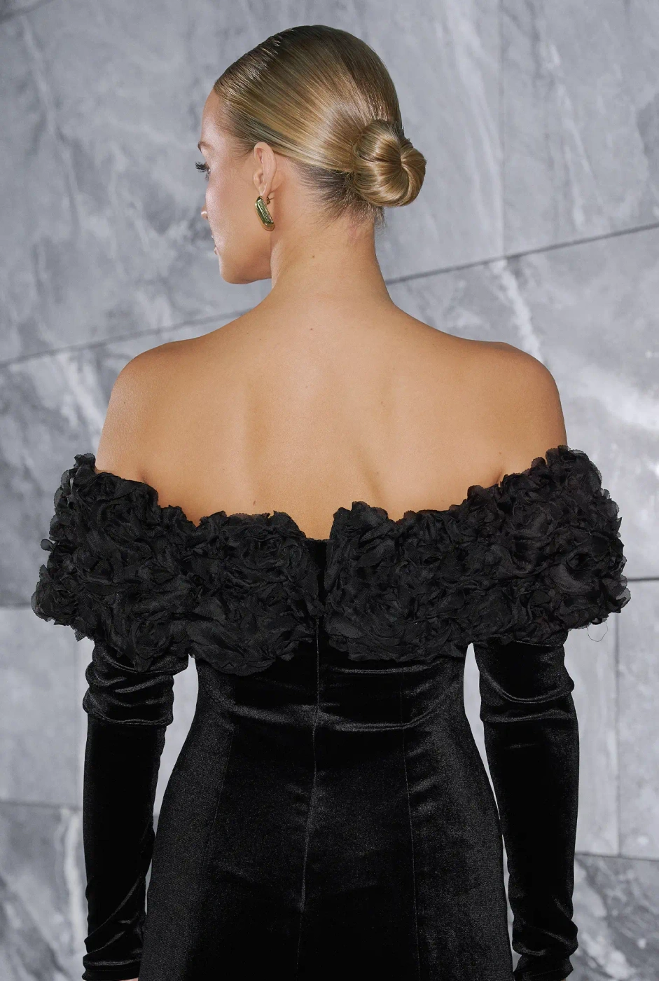 Vayana – black mini dress with floral embellishment