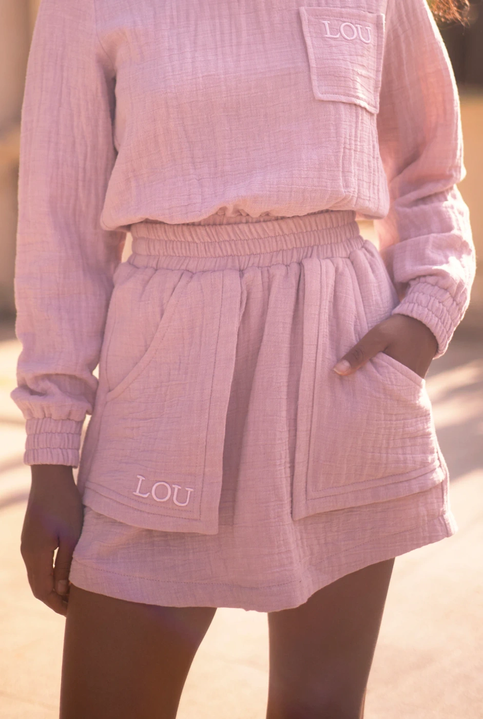 Kama - Pink tracksuit set with mini skirt and embroideries