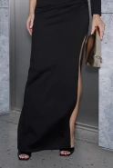Elegante – black asymmetrical maxi dress with a feather brooch
